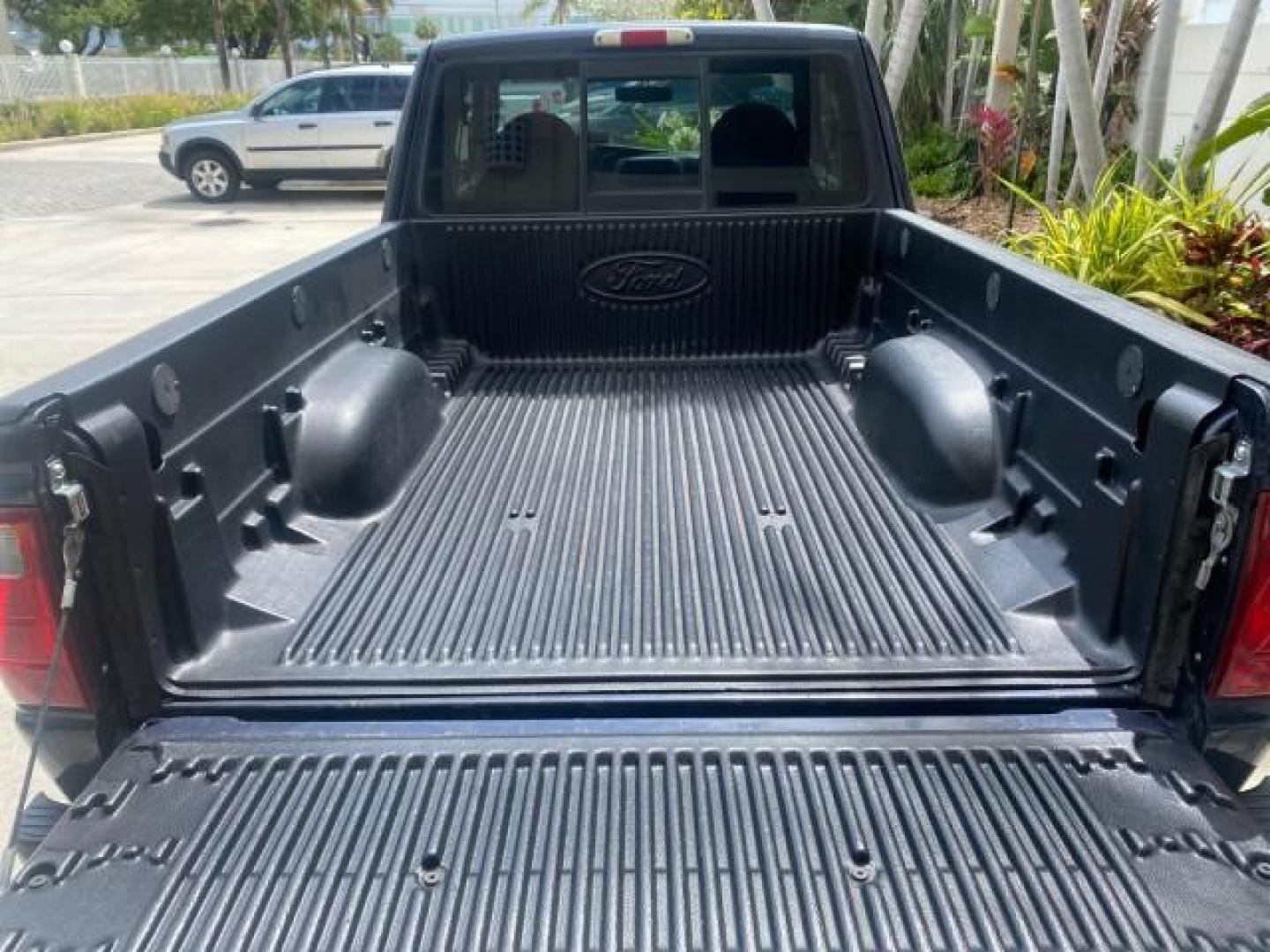 2003 Deep Wedgewood Blue Metallic /Dark Graphite Ford Ranger XLT AUTO X CAB LOW MILES 76,750 (1FTYR44V53P) with an 3.0L SEFI Flex-Fuel FFV V6 Engine engine, Automatic transmission, located at 4701 North Dixie Hwy, Pompano Beach, FL, 33064, (954) 422-2889, 26.240938, -80.123474 - OUR WEBPAGE FLORIDACARS1.COM HAS OVER 100 PHOTOS AND FREE CARFAX LINK 2003 Ford Ranger XLT AUTO AC LOADED GOOD FOR POOL SERVICE OR DELIEVERY SERVICE VERY DEPENDABLE 4 Door Extended Cab Pickup 3.0L V6 F Flex Fuel 23 MPG Rear Wheel Drive Features ABS Brakes Air Conditioning AM/FM Stereo Automatic Tran- Photo#98