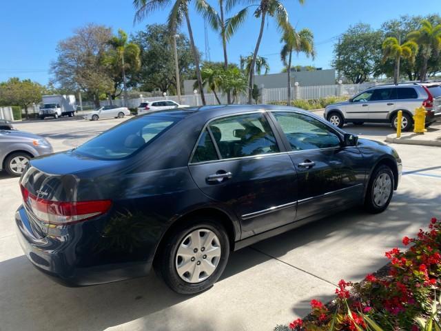 2004 Graphite Pearl /Gray Honda Accord Sdn LX LOW MILES 68,079 (1HGCM56344A) with an 2.4L DOHC MPFI 16-Valve i-VTEC I4 Engine engine, Automatic transmission, located at 4701 North Dixie Hwy, Pompano Beach, FL, 33064, (954) 422-2889, 26.240938, -80.123474 - OUR WEBPAGE FLORIDACARS1.COM HAS OVER 100 PHOTOS AND FREE CARFAX LINK 2004 Honda Accord LX Sedan 4 DR 2.4L I4 F DOHC Gasoline 34 MPG Front Wheel Drive Features ABS Brakes Air Conditioning AM/FM Stereo Automatic Transmission Cassette Player CD Audio Cloth Seats Cruise Control Power Locks Power Mirror - Photo#7