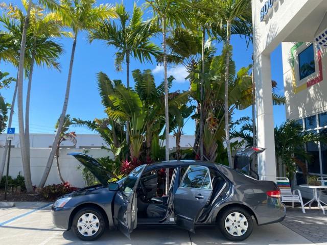 2004 Graphite Pearl /Gray Honda Accord Sdn LX LOW MILES 68,079 (1HGCM56344A) with an 2.4L DOHC MPFI 16-Valve i-VTEC I4 Engine engine, Automatic transmission, located at 4701 North Dixie Hwy, Pompano Beach, FL, 33064, (954) 422-2889, 26.240938, -80.123474 - OUR WEBPAGE FLORIDACARS1.COM HAS OVER 100 PHOTOS AND FREE CARFAX LINK 2004 Honda Accord LX Sedan 4 DR 2.4L I4 F DOHC Gasoline 34 MPG Front Wheel Drive Features ABS Brakes Air Conditioning AM/FM Stereo Automatic Transmission Cassette Player CD Audio Cloth Seats Cruise Control Power Locks Power Mirror - Photo#8
