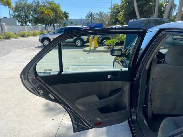 2004 Graphite Pearl /Gray Honda Accord Sdn LX LOW MILES 68,079 (1HGCM56344A) with an 2.4L DOHC MPFI 16-Valve i-VTEC I4 Engine engine, Automatic transmission, located at 4701 North Dixie Hwy, Pompano Beach, FL, 33064, (954) 422-2889, 26.240938, -80.123474 - OUR WEBPAGE FLORIDACARS1.COM HAS OVER 100 PHOTOS AND FREE CARFAX LINK 2004 Honda Accord LX Sedan 4 DR 2.4L I4 F DOHC Gasoline 34 MPG Front Wheel Drive Features ABS Brakes Air Conditioning AM/FM Stereo Automatic Transmission Cassette Player CD Audio Cloth Seats Cruise Control Power Locks Power Mirror - Photo#13