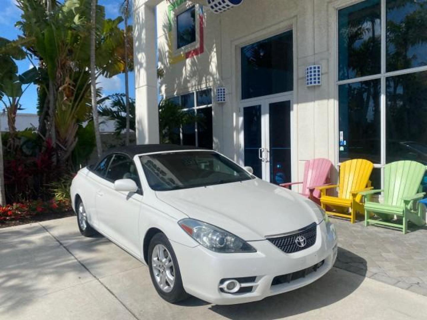 2008 Blizzard White Pearl /Dark Gray Toyota Camry Solara SE CONVERTIBLE LOW MILES 74,665 (4T1FA38PX8U) with an 3.3L DOHC SMPI VVT-i 24-Valve V6 Engine engine, Automatic transmission, located at 4701 North Dixie Hwy, Pompano Beach, FL, 33064, (954) 422-2889, 26.240938, -80.123474 - OUR WEBPAGE FLORIDACARS1.COM HAS OVER 100 PHOTOS AND FREE CARFAX LINK 2008 Toyota Camry Solara SE V6 Convertible 3.3L V6 F DOHC 24V Gasoline 29 MPG Front Wheel Drive Features ABS Brakes Air Conditioning Alloy Wheels AM/FM Stereo Automatic Transmission Auxiliary Audio Input CD Audio Cruise Control Le- Photo#1