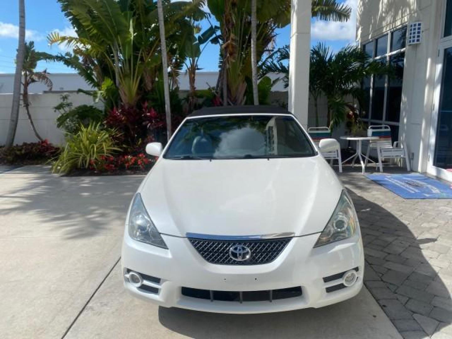 2008 Blizzard White Pearl /Dark Gray Toyota Camry Solara SE CONVERTIBLE LOW MILES 74,665 (4T1FA38PX8U) with an 3.3L DOHC SMPI VVT-i 24-Valve V6 Engine engine, Automatic transmission, located at 4701 North Dixie Hwy, Pompano Beach, FL, 33064, (954) 422-2889, 26.240938, -80.123474 - OUR WEBPAGE FLORIDACARS1.COM HAS OVER 100 PHOTOS AND FREE CARFAX LINK 2008 Toyota Camry Solara SE V6 Convertible 3.3L V6 F DOHC 24V Gasoline 29 MPG Front Wheel Drive Features ABS Brakes Air Conditioning Alloy Wheels AM/FM Stereo Automatic Transmission Auxiliary Audio Input CD Audio Cruise Control Le- Photo#2