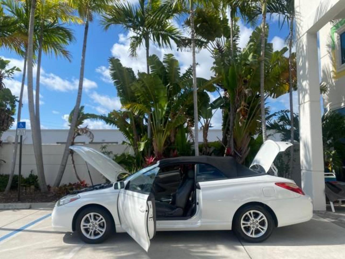 2008 Blizzard White Pearl /Dark Gray Toyota Camry Solara SE CONVERTIBLE LOW MILES 74,665 (4T1FA38PX8U) with an 3.3L DOHC SMPI VVT-i 24-Valve V6 Engine engine, Automatic transmission, located at 4701 North Dixie Hwy, Pompano Beach, FL, 33064, (954) 422-2889, 26.240938, -80.123474 - OUR WEBPAGE FLORIDACARS1.COM HAS OVER 100 PHOTOS AND FREE CARFAX LINK 2008 Toyota Camry Solara SE V6 Convertible 3.3L V6 F DOHC 24V Gasoline 29 MPG Front Wheel Drive Features ABS Brakes Air Conditioning Alloy Wheels AM/FM Stereo Automatic Transmission Auxiliary Audio Input CD Audio Cruise Control Le- Photo#8