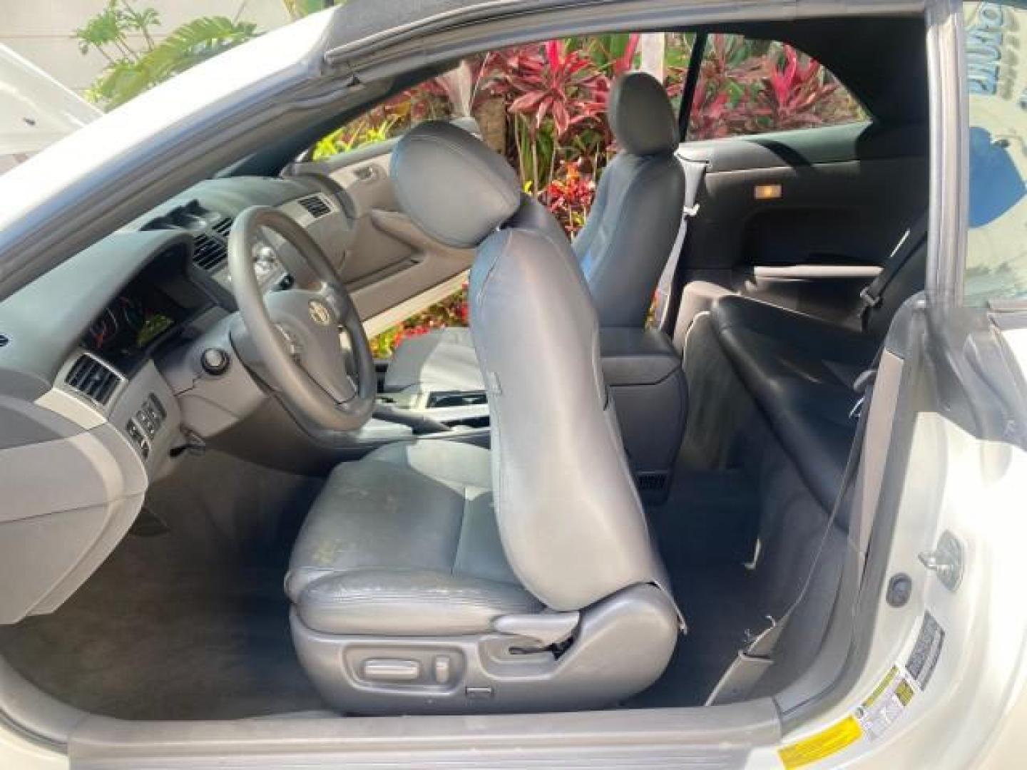 2008 Blizzard White Pearl /Dark Gray Toyota Camry Solara SE CONVERTIBLE LOW MILES 74,665 (4T1FA38PX8U) with an 3.3L DOHC SMPI VVT-i 24-Valve V6 Engine engine, Automatic transmission, located at 4701 North Dixie Hwy, Pompano Beach, FL, 33064, (954) 422-2889, 26.240938, -80.123474 - OUR WEBPAGE FLORIDACARS1.COM HAS OVER 100 PHOTOS AND FREE CARFAX LINK 2008 Toyota Camry Solara SE V6 Convertible 3.3L V6 F DOHC 24V Gasoline 29 MPG Front Wheel Drive Features ABS Brakes Air Conditioning Alloy Wheels AM/FM Stereo Automatic Transmission Auxiliary Audio Input CD Audio Cruise Control Le- Photo#13