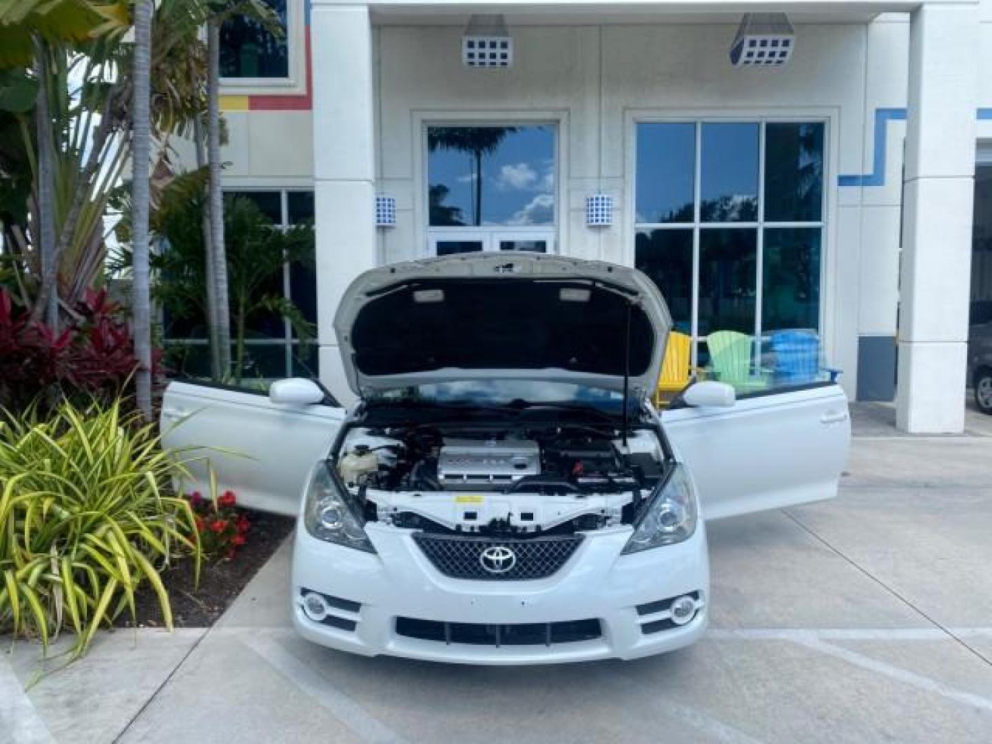 2008 Blizzard White Pearl /Dark Gray Toyota Camry Solara SE CONVERTIBLE LOW MILES 74,665 (4T1FA38PX8U) with an 3.3L DOHC SMPI VVT-i 24-Valve V6 Engine engine, Automatic transmission, located at 4701 North Dixie Hwy, Pompano Beach, FL, 33064, (954) 422-2889, 26.240938, -80.123474 - OUR WEBPAGE FLORIDACARS1.COM HAS OVER 100 PHOTOS AND FREE CARFAX LINK 2008 Toyota Camry Solara SE V6 Convertible 3.3L V6 F DOHC 24V Gasoline 29 MPG Front Wheel Drive Features ABS Brakes Air Conditioning Alloy Wheels AM/FM Stereo Automatic Transmission Auxiliary Audio Input CD Audio Cruise Control Le- Photo#16