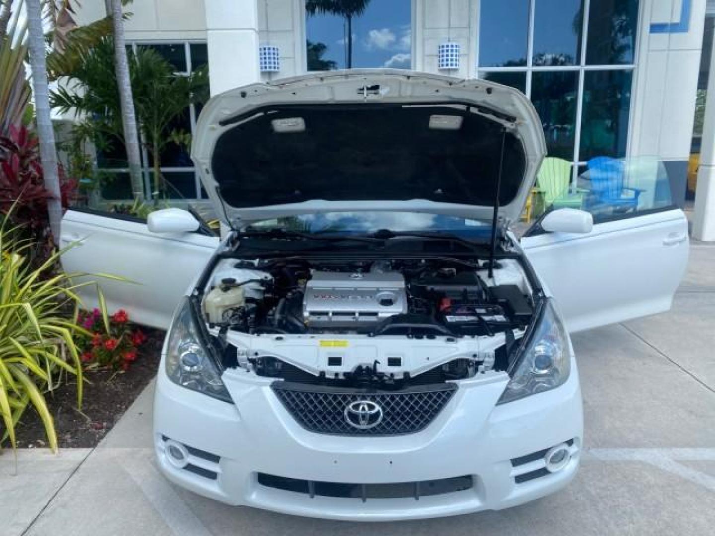2008 Blizzard White Pearl /Dark Gray Toyota Camry Solara SE CONVERTIBLE LOW MILES 74,665 (4T1FA38PX8U) with an 3.3L DOHC SMPI VVT-i 24-Valve V6 Engine engine, Automatic transmission, located at 4701 North Dixie Hwy, Pompano Beach, FL, 33064, (954) 422-2889, 26.240938, -80.123474 - OUR WEBPAGE FLORIDACARS1.COM HAS OVER 100 PHOTOS AND FREE CARFAX LINK 2008 Toyota Camry Solara SE V6 Convertible 3.3L V6 F DOHC 24V Gasoline 29 MPG Front Wheel Drive Features ABS Brakes Air Conditioning Alloy Wheels AM/FM Stereo Automatic Transmission Auxiliary Audio Input CD Audio Cruise Control Le- Photo#17