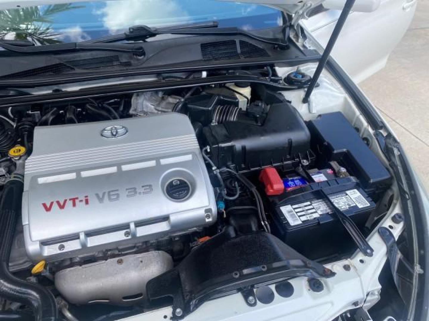 2008 Blizzard White Pearl /Dark Gray Toyota Camry Solara SE CONVERTIBLE LOW MILES 74,665 (4T1FA38PX8U) with an 3.3L DOHC SMPI VVT-i 24-Valve V6 Engine engine, Automatic transmission, located at 4701 North Dixie Hwy, Pompano Beach, FL, 33064, (954) 422-2889, 26.240938, -80.123474 - OUR WEBPAGE FLORIDACARS1.COM HAS OVER 100 PHOTOS AND FREE CARFAX LINK 2008 Toyota Camry Solara SE V6 Convertible 3.3L V6 F DOHC 24V Gasoline 29 MPG Front Wheel Drive Features ABS Brakes Air Conditioning Alloy Wheels AM/FM Stereo Automatic Transmission Auxiliary Audio Input CD Audio Cruise Control Le- Photo#25