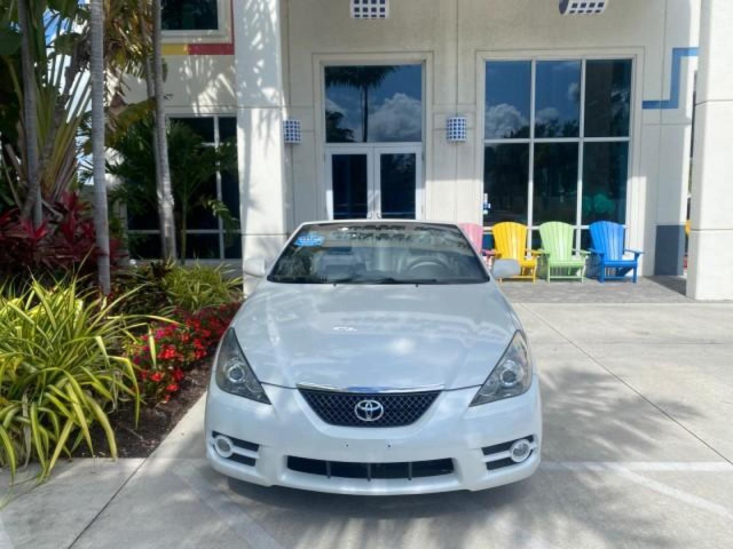 2008 Blizzard White Pearl /Dark Gray Toyota Camry Solara SE CONVERTIBLE LOW MILES 74,665 (4T1FA38PX8U) with an 3.3L DOHC SMPI VVT-i 24-Valve V6 Engine engine, Automatic transmission, located at 4701 North Dixie Hwy, Pompano Beach, FL, 33064, (954) 422-2889, 26.240938, -80.123474 - OUR WEBPAGE FLORIDACARS1.COM HAS OVER 100 PHOTOS AND FREE CARFAX LINK 2008 Toyota Camry Solara SE V6 Convertible 3.3L V6 F DOHC 24V Gasoline 29 MPG Front Wheel Drive Features ABS Brakes Air Conditioning Alloy Wheels AM/FM Stereo Automatic Transmission Auxiliary Audio Input CD Audio Cruise Control Le- Photo#27