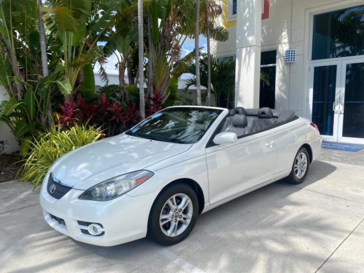 2008 Blizzard White Pearl /Dark Gray Toyota Camry Solara SE CONVERTIBLE LOW MILES 74,665 (4T1FA38PX8U) with an 3.3L DOHC SMPI VVT-i 24-Valve V6 Engine engine, Automatic transmission, located at 4701 North Dixie Hwy, Pompano Beach, FL, 33064, (954) 422-2889, 26.240938, -80.123474 - OUR WEBPAGE FLORIDACARS1.COM HAS OVER 100 PHOTOS AND FREE CARFAX LINK 2008 Toyota Camry Solara SE V6 Convertible 3.3L V6 F DOHC 24V Gasoline 29 MPG Front Wheel Drive Features ABS Brakes Air Conditioning Alloy Wheels AM/FM Stereo Automatic Transmission Auxiliary Audio Input CD Audio Cruise Control Le- Photo#31