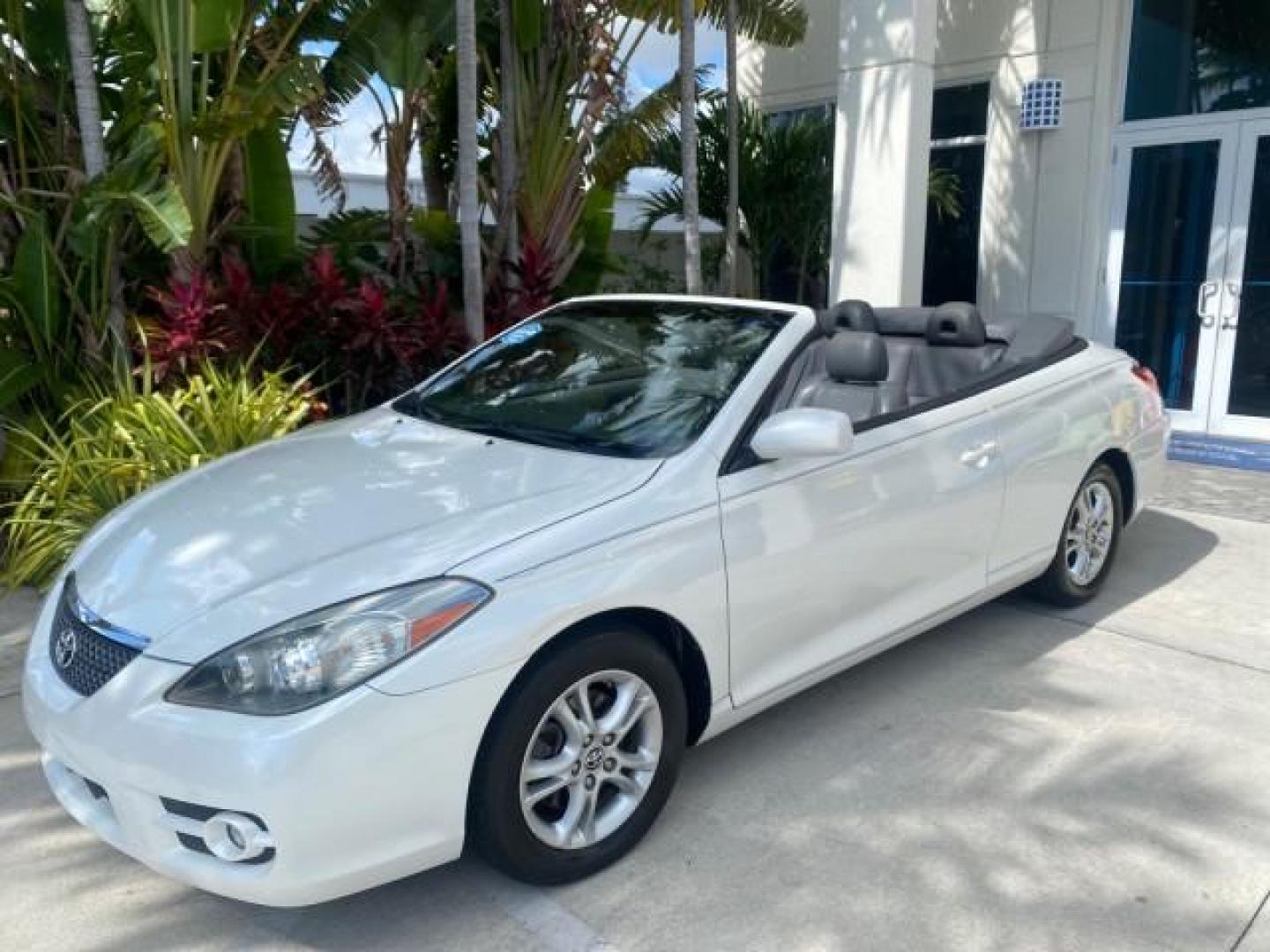 2008 Blizzard White Pearl /Dark Gray Toyota Camry Solara SE CONVERTIBLE LOW MILES 74,665 (4T1FA38PX8U) with an 3.3L DOHC SMPI VVT-i 24-Valve V6 Engine engine, Automatic transmission, located at 4701 North Dixie Hwy, Pompano Beach, FL, 33064, (954) 422-2889, 26.240938, -80.123474 - OUR WEBPAGE FLORIDACARS1.COM HAS OVER 100 PHOTOS AND FREE CARFAX LINK 2008 Toyota Camry Solara SE V6 Convertible 3.3L V6 F DOHC 24V Gasoline 29 MPG Front Wheel Drive Features ABS Brakes Air Conditioning Alloy Wheels AM/FM Stereo Automatic Transmission Auxiliary Audio Input CD Audio Cruise Control Le- Photo#33