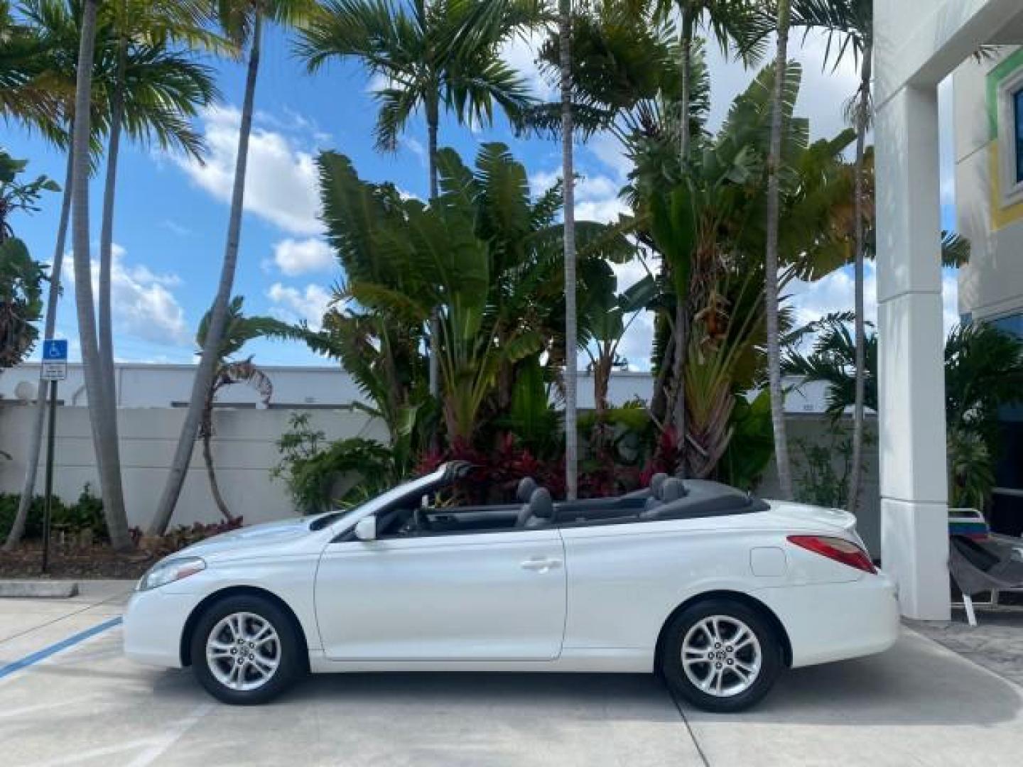 2008 Blizzard White Pearl /Dark Gray Toyota Camry Solara SE CONVERTIBLE LOW MILES 74,665 (4T1FA38PX8U) with an 3.3L DOHC SMPI VVT-i 24-Valve V6 Engine engine, Automatic transmission, located at 4701 North Dixie Hwy, Pompano Beach, FL, 33064, (954) 422-2889, 26.240938, -80.123474 - OUR WEBPAGE FLORIDACARS1.COM HAS OVER 100 PHOTOS AND FREE CARFAX LINK 2008 Toyota Camry Solara SE V6 Convertible 3.3L V6 F DOHC 24V Gasoline 29 MPG Front Wheel Drive Features ABS Brakes Air Conditioning Alloy Wheels AM/FM Stereo Automatic Transmission Auxiliary Audio Input CD Audio Cruise Control Le- Photo#35