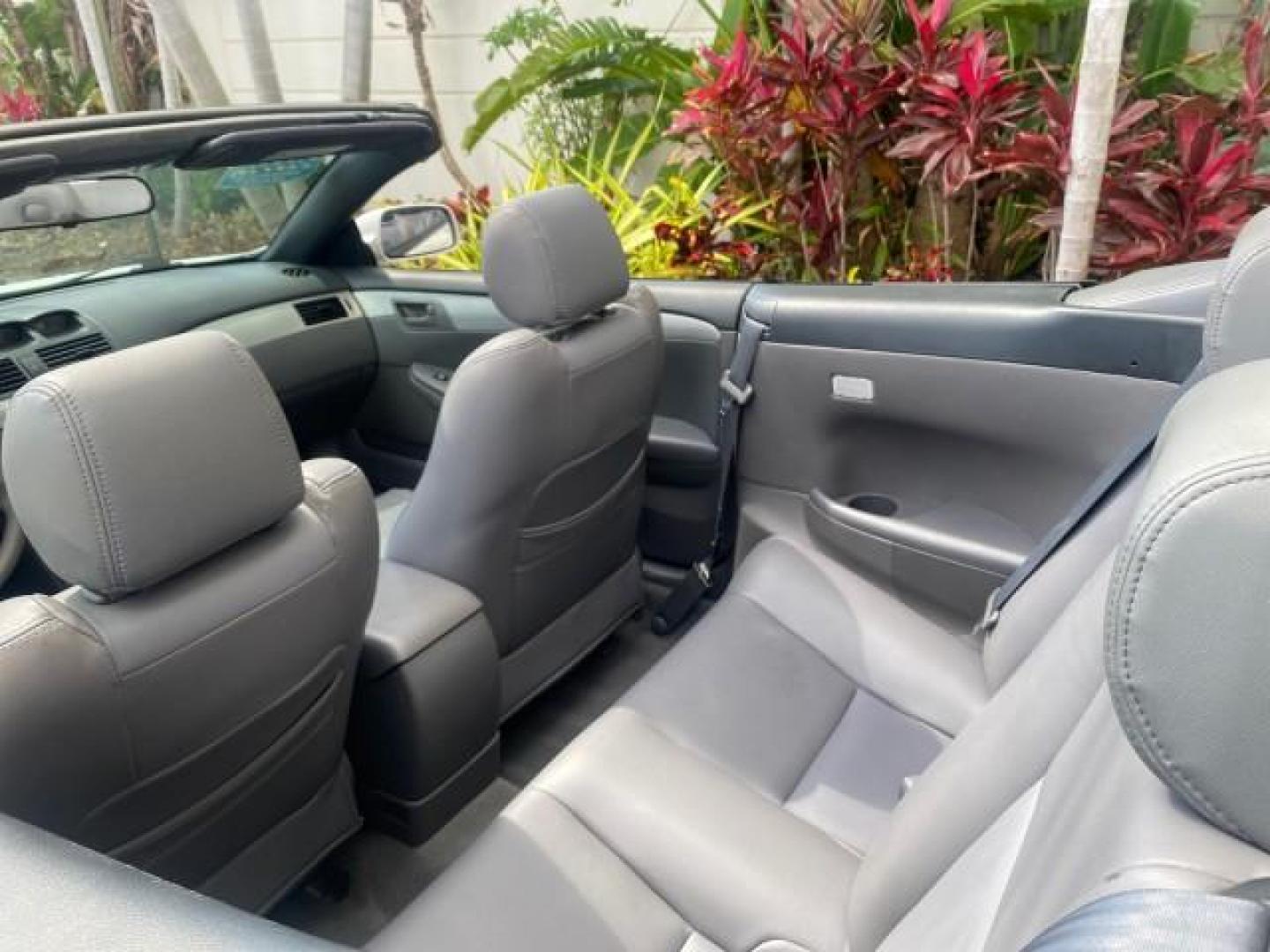 2008 Blizzard White Pearl /Dark Gray Toyota Camry Solara SE CONVERTIBLE LOW MILES 74,665 (4T1FA38PX8U) with an 3.3L DOHC SMPI VVT-i 24-Valve V6 Engine engine, Automatic transmission, located at 4701 North Dixie Hwy, Pompano Beach, FL, 33064, (954) 422-2889, 26.240938, -80.123474 - OUR WEBPAGE FLORIDACARS1.COM HAS OVER 100 PHOTOS AND FREE CARFAX LINK 2008 Toyota Camry Solara SE V6 Convertible 3.3L V6 F DOHC 24V Gasoline 29 MPG Front Wheel Drive Features ABS Brakes Air Conditioning Alloy Wheels AM/FM Stereo Automatic Transmission Auxiliary Audio Input CD Audio Cruise Control Le- Photo#48