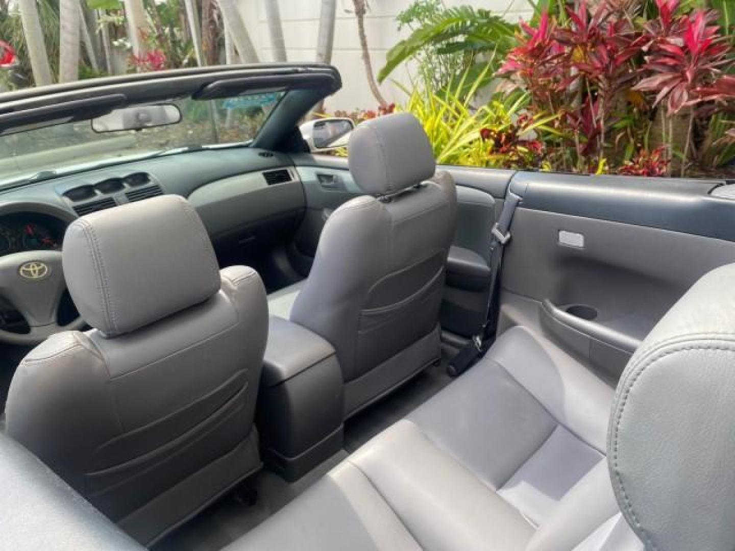 2008 Blizzard White Pearl /Dark Gray Toyota Camry Solara SE CONVERTIBLE LOW MILES 74,665 (4T1FA38PX8U) with an 3.3L DOHC SMPI VVT-i 24-Valve V6 Engine engine, Automatic transmission, located at 4701 North Dixie Hwy, Pompano Beach, FL, 33064, (954) 422-2889, 26.240938, -80.123474 - OUR WEBPAGE FLORIDACARS1.COM HAS OVER 100 PHOTOS AND FREE CARFAX LINK 2008 Toyota Camry Solara SE V6 Convertible 3.3L V6 F DOHC 24V Gasoline 29 MPG Front Wheel Drive Features ABS Brakes Air Conditioning Alloy Wheels AM/FM Stereo Automatic Transmission Auxiliary Audio Input CD Audio Cruise Control Le- Photo#49