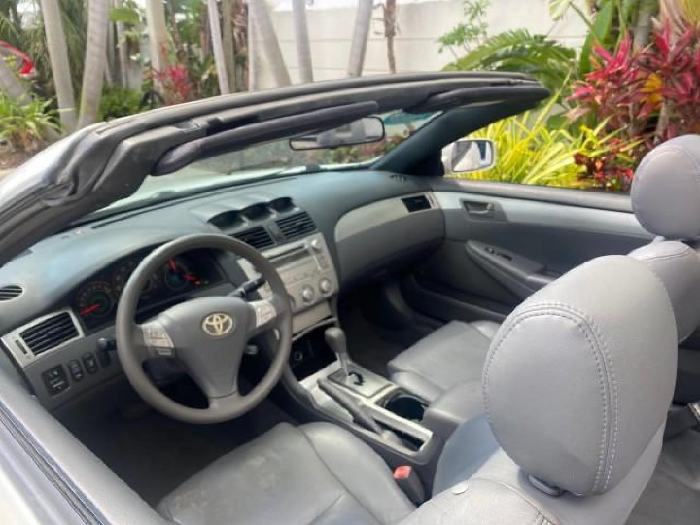 2008 Blizzard White Pearl /Dark Gray Toyota Camry Solara SE CONVERTIBLE LOW MILES 74,665 (4T1FA38PX8U) with an 3.3L DOHC SMPI VVT-i 24-Valve V6 Engine engine, Automatic transmission, located at 4701 North Dixie Hwy, Pompano Beach, FL, 33064, (954) 422-2889, 26.240938, -80.123474 - OUR WEBPAGE FLORIDACARS1.COM HAS OVER 100 PHOTOS AND FREE CARFAX LINK 2008 Toyota Camry Solara SE V6 Convertible 3.3L V6 F DOHC 24V Gasoline 29 MPG Front Wheel Drive Features ABS Brakes Air Conditioning Alloy Wheels AM/FM Stereo Automatic Transmission Auxiliary Audio Input CD Audio Cruise Control Le- Photo#51