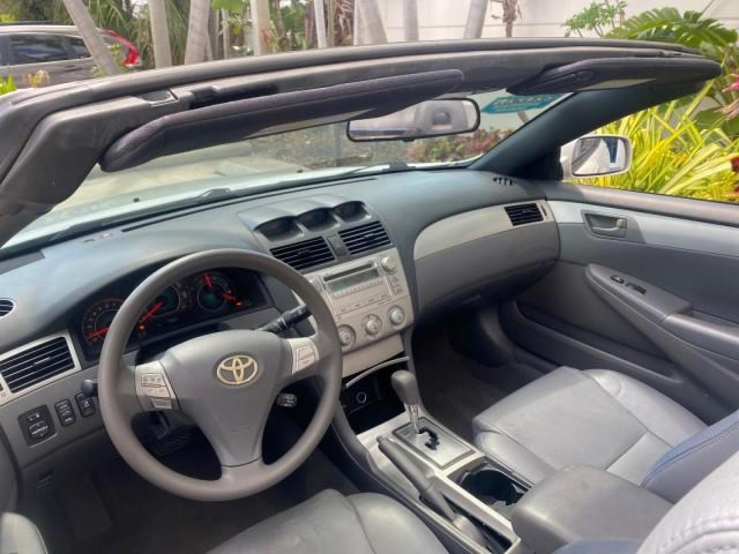 2008 Blizzard White Pearl /Dark Gray Toyota Camry Solara SE CONVERTIBLE LOW MILES 74,665 (4T1FA38PX8U) with an 3.3L DOHC SMPI VVT-i 24-Valve V6 Engine engine, Automatic transmission, located at 4701 North Dixie Hwy, Pompano Beach, FL, 33064, (954) 422-2889, 26.240938, -80.123474 - OUR WEBPAGE FLORIDACARS1.COM HAS OVER 100 PHOTOS AND FREE CARFAX LINK 2008 Toyota Camry Solara SE V6 Convertible 3.3L V6 F DOHC 24V Gasoline 29 MPG Front Wheel Drive Features ABS Brakes Air Conditioning Alloy Wheels AM/FM Stereo Automatic Transmission Auxiliary Audio Input CD Audio Cruise Control Le- Photo#52