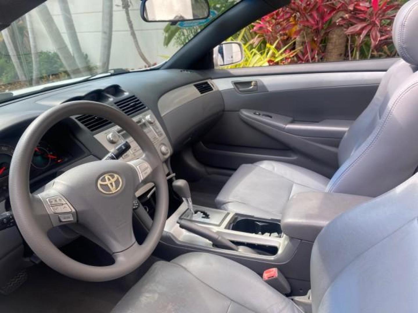 2008 Blizzard White Pearl /Dark Gray Toyota Camry Solara SE CONVERTIBLE LOW MILES 74,665 (4T1FA38PX8U) with an 3.3L DOHC SMPI VVT-i 24-Valve V6 Engine engine, Automatic transmission, located at 4701 North Dixie Hwy, Pompano Beach, FL, 33064, (954) 422-2889, 26.240938, -80.123474 - OUR WEBPAGE FLORIDACARS1.COM HAS OVER 100 PHOTOS AND FREE CARFAX LINK 2008 Toyota Camry Solara SE V6 Convertible 3.3L V6 F DOHC 24V Gasoline 29 MPG Front Wheel Drive Features ABS Brakes Air Conditioning Alloy Wheels AM/FM Stereo Automatic Transmission Auxiliary Audio Input CD Audio Cruise Control Le- Photo#53