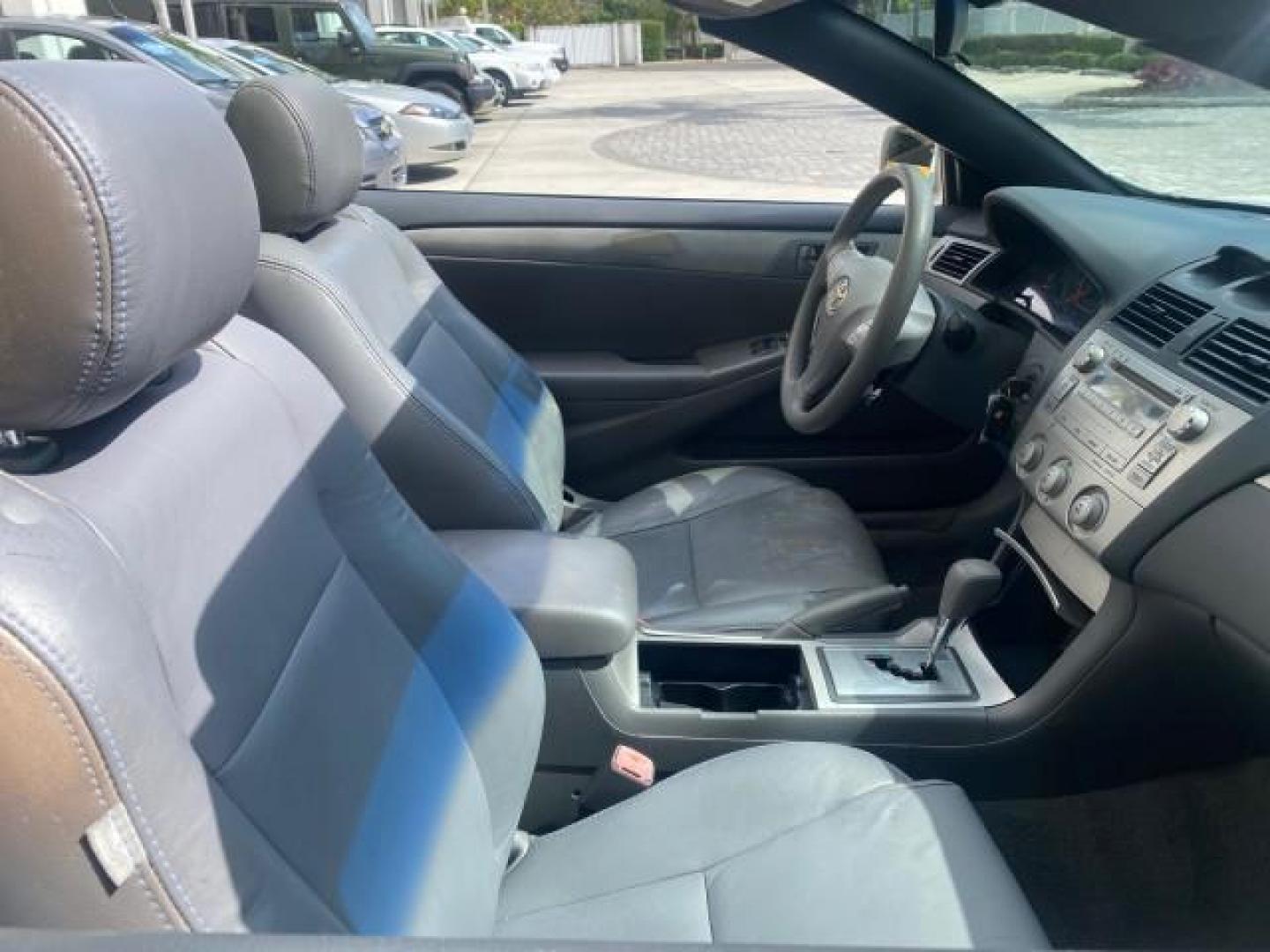 2008 Blizzard White Pearl /Dark Gray Toyota Camry Solara SE CONVERTIBLE LOW MILES 74,665 (4T1FA38PX8U) with an 3.3L DOHC SMPI VVT-i 24-Valve V6 Engine engine, Automatic transmission, located at 4701 North Dixie Hwy, Pompano Beach, FL, 33064, (954) 422-2889, 26.240938, -80.123474 - OUR WEBPAGE FLORIDACARS1.COM HAS OVER 100 PHOTOS AND FREE CARFAX LINK 2008 Toyota Camry Solara SE V6 Convertible 3.3L V6 F DOHC 24V Gasoline 29 MPG Front Wheel Drive Features ABS Brakes Air Conditioning Alloy Wheels AM/FM Stereo Automatic Transmission Auxiliary Audio Input CD Audio Cruise Control Le- Photo#55