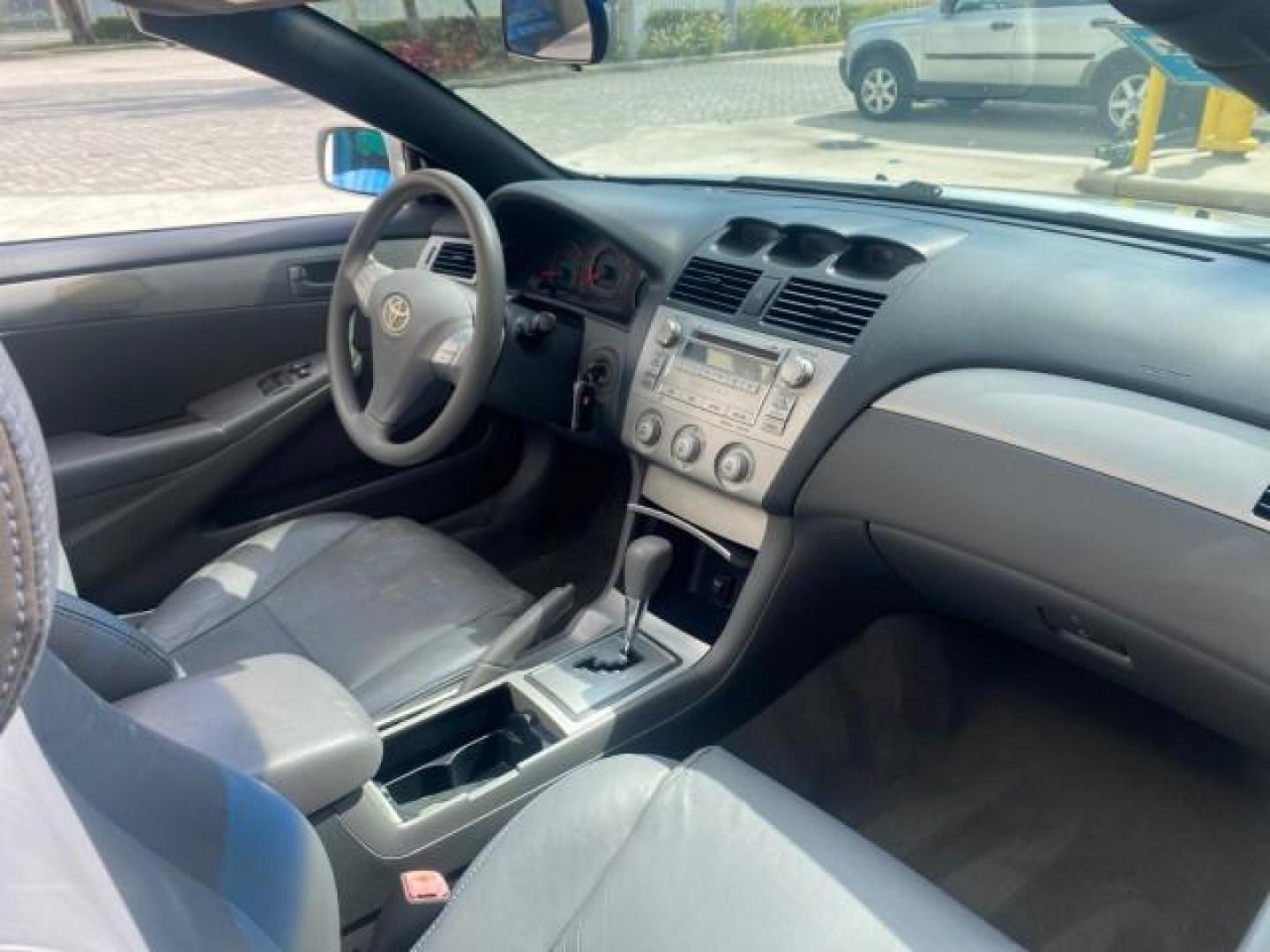 2008 Blizzard White Pearl /Dark Gray Toyota Camry Solara SE CONVERTIBLE LOW MILES 74,665 (4T1FA38PX8U) with an 3.3L DOHC SMPI VVT-i 24-Valve V6 Engine engine, Automatic transmission, located at 4701 North Dixie Hwy, Pompano Beach, FL, 33064, (954) 422-2889, 26.240938, -80.123474 - OUR WEBPAGE FLORIDACARS1.COM HAS OVER 100 PHOTOS AND FREE CARFAX LINK 2008 Toyota Camry Solara SE V6 Convertible 3.3L V6 F DOHC 24V Gasoline 29 MPG Front Wheel Drive Features ABS Brakes Air Conditioning Alloy Wheels AM/FM Stereo Automatic Transmission Auxiliary Audio Input CD Audio Cruise Control Le- Photo#56