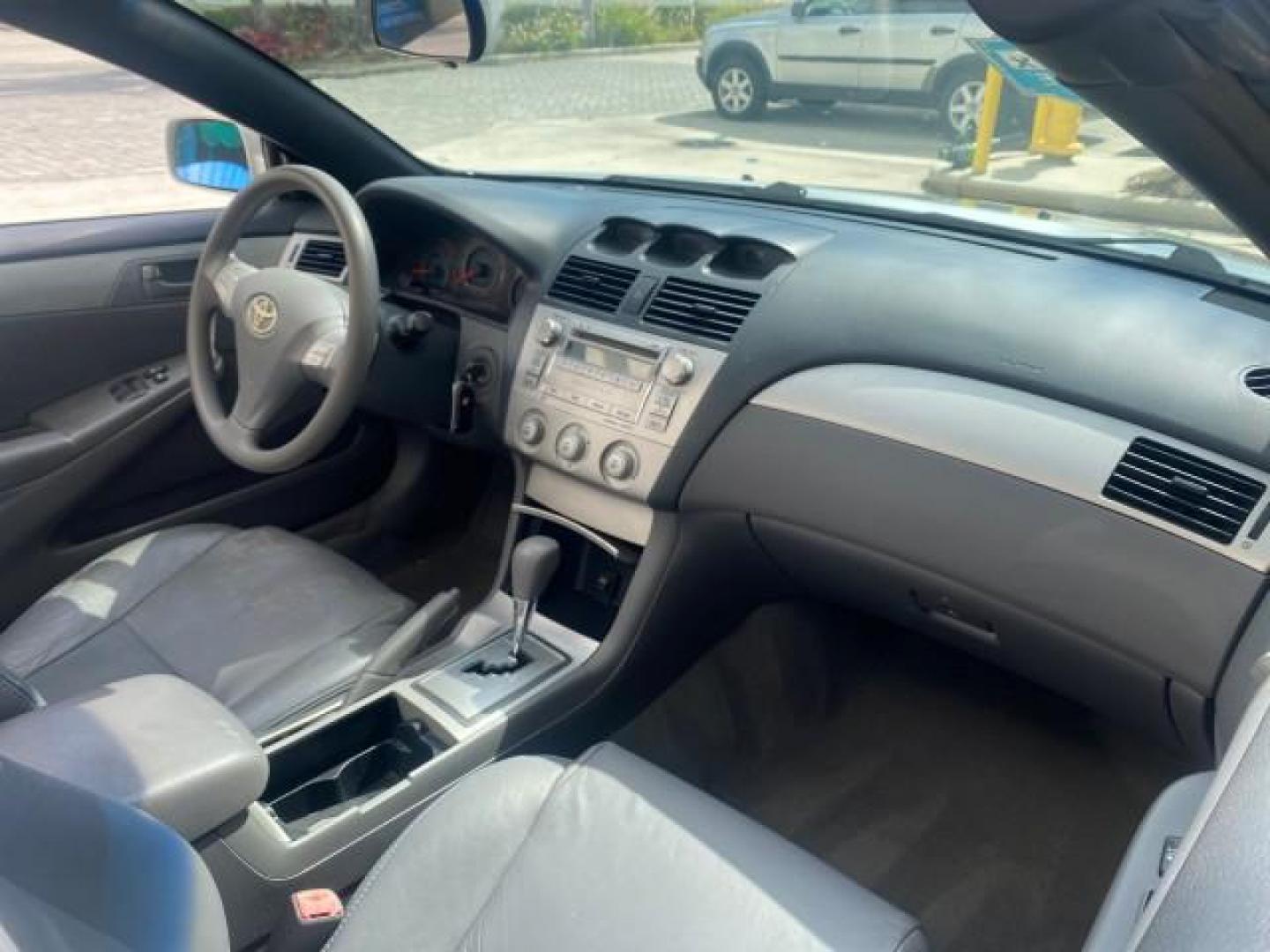 2008 Blizzard White Pearl /Dark Gray Toyota Camry Solara SE CONVERTIBLE LOW MILES 74,665 (4T1FA38PX8U) with an 3.3L DOHC SMPI VVT-i 24-Valve V6 Engine engine, Automatic transmission, located at 4701 North Dixie Hwy, Pompano Beach, FL, 33064, (954) 422-2889, 26.240938, -80.123474 - OUR WEBPAGE FLORIDACARS1.COM HAS OVER 100 PHOTOS AND FREE CARFAX LINK 2008 Toyota Camry Solara SE V6 Convertible 3.3L V6 F DOHC 24V Gasoline 29 MPG Front Wheel Drive Features ABS Brakes Air Conditioning Alloy Wheels AM/FM Stereo Automatic Transmission Auxiliary Audio Input CD Audio Cruise Control Le- Photo#57