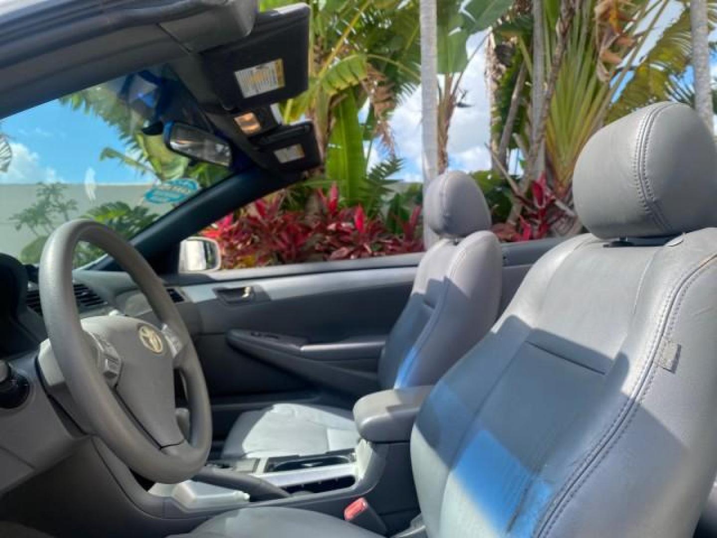 2008 Blizzard White Pearl /Dark Gray Toyota Camry Solara SE CONVERTIBLE LOW MILES 74,665 (4T1FA38PX8U) with an 3.3L DOHC SMPI VVT-i 24-Valve V6 Engine engine, Automatic transmission, located at 4701 North Dixie Hwy, Pompano Beach, FL, 33064, (954) 422-2889, 26.240938, -80.123474 - OUR WEBPAGE FLORIDACARS1.COM HAS OVER 100 PHOTOS AND FREE CARFAX LINK 2008 Toyota Camry Solara SE V6 Convertible 3.3L V6 F DOHC 24V Gasoline 29 MPG Front Wheel Drive Features ABS Brakes Air Conditioning Alloy Wheels AM/FM Stereo Automatic Transmission Auxiliary Audio Input CD Audio Cruise Control Le- Photo#74