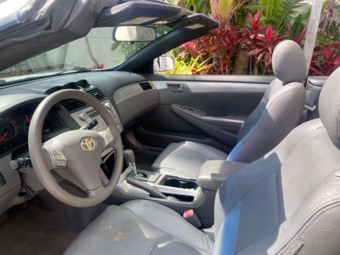 2008 Blizzard White Pearl /Dark Gray Toyota Camry Solara SE CONVERTIBLE LOW MILES 74,665 (4T1FA38PX8U) with an 3.3L DOHC SMPI VVT-i 24-Valve V6 Engine engine, Automatic transmission, located at 4701 North Dixie Hwy, Pompano Beach, FL, 33064, (954) 422-2889, 26.240938, -80.123474 - OUR WEBPAGE FLORIDACARS1.COM HAS OVER 100 PHOTOS AND FREE CARFAX LINK 2008 Toyota Camry Solara SE V6 Convertible 3.3L V6 F DOHC 24V Gasoline 29 MPG Front Wheel Drive Features ABS Brakes Air Conditioning Alloy Wheels AM/FM Stereo Automatic Transmission Auxiliary Audio Input CD Audio Cruise Control Le- Photo#75