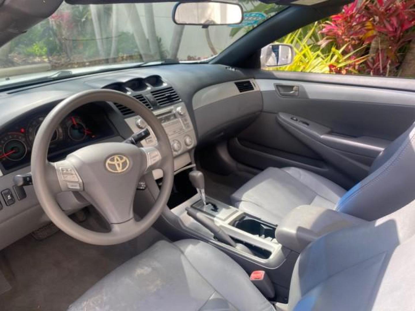 2008 Blizzard White Pearl /Dark Gray Toyota Camry Solara SE CONVERTIBLE LOW MILES 74,665 (4T1FA38PX8U) with an 3.3L DOHC SMPI VVT-i 24-Valve V6 Engine engine, Automatic transmission, located at 4701 North Dixie Hwy, Pompano Beach, FL, 33064, (954) 422-2889, 26.240938, -80.123474 - OUR WEBPAGE FLORIDACARS1.COM HAS OVER 100 PHOTOS AND FREE CARFAX LINK 2008 Toyota Camry Solara SE V6 Convertible 3.3L V6 F DOHC 24V Gasoline 29 MPG Front Wheel Drive Features ABS Brakes Air Conditioning Alloy Wheels AM/FM Stereo Automatic Transmission Auxiliary Audio Input CD Audio Cruise Control Le- Photo#76