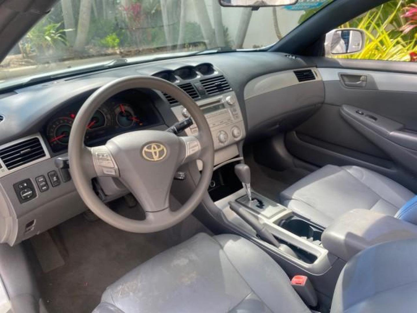 2008 Blizzard White Pearl /Dark Gray Toyota Camry Solara SE CONVERTIBLE LOW MILES 74,665 (4T1FA38PX8U) with an 3.3L DOHC SMPI VVT-i 24-Valve V6 Engine engine, Automatic transmission, located at 4701 North Dixie Hwy, Pompano Beach, FL, 33064, (954) 422-2889, 26.240938, -80.123474 - OUR WEBPAGE FLORIDACARS1.COM HAS OVER 100 PHOTOS AND FREE CARFAX LINK 2008 Toyota Camry Solara SE V6 Convertible 3.3L V6 F DOHC 24V Gasoline 29 MPG Front Wheel Drive Features ABS Brakes Air Conditioning Alloy Wheels AM/FM Stereo Automatic Transmission Auxiliary Audio Input CD Audio Cruise Control Le- Photo#77