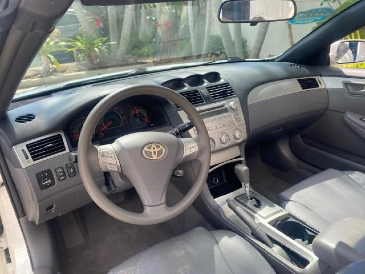 2008 Blizzard White Pearl /Dark Gray Toyota Camry Solara SE CONVERTIBLE LOW MILES 74,665 (4T1FA38PX8U) with an 3.3L DOHC SMPI VVT-i 24-Valve V6 Engine engine, Automatic transmission, located at 4701 North Dixie Hwy, Pompano Beach, FL, 33064, (954) 422-2889, 26.240938, -80.123474 - OUR WEBPAGE FLORIDACARS1.COM HAS OVER 100 PHOTOS AND FREE CARFAX LINK 2008 Toyota Camry Solara SE V6 Convertible 3.3L V6 F DOHC 24V Gasoline 29 MPG Front Wheel Drive Features ABS Brakes Air Conditioning Alloy Wheels AM/FM Stereo Automatic Transmission Auxiliary Audio Input CD Audio Cruise Control Le- Photo#78