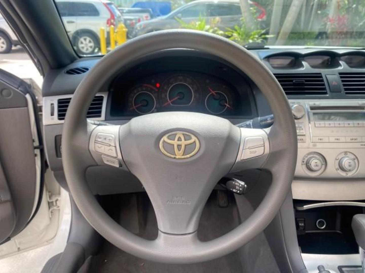 2008 Blizzard White Pearl /Dark Gray Toyota Camry Solara SE CONVERTIBLE LOW MILES 74,665 (4T1FA38PX8U) with an 3.3L DOHC SMPI VVT-i 24-Valve V6 Engine engine, Automatic transmission, located at 4701 North Dixie Hwy, Pompano Beach, FL, 33064, (954) 422-2889, 26.240938, -80.123474 - OUR WEBPAGE FLORIDACARS1.COM HAS OVER 100 PHOTOS AND FREE CARFAX LINK 2008 Toyota Camry Solara SE V6 Convertible 3.3L V6 F DOHC 24V Gasoline 29 MPG Front Wheel Drive Features ABS Brakes Air Conditioning Alloy Wheels AM/FM Stereo Automatic Transmission Auxiliary Audio Input CD Audio Cruise Control Le- Photo#79