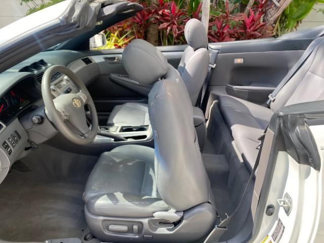 2008 Blizzard White Pearl /Dark Gray Toyota Camry Solara SE CONVERTIBLE LOW MILES 74,665 (4T1FA38PX8U) with an 3.3L DOHC SMPI VVT-i 24-Valve V6 Engine engine, Automatic transmission, located at 4701 North Dixie Hwy, Pompano Beach, FL, 33064, (954) 422-2889, 26.240938, -80.123474 - OUR WEBPAGE FLORIDACARS1.COM HAS OVER 100 PHOTOS AND FREE CARFAX LINK 2008 Toyota Camry Solara SE V6 Convertible 3.3L V6 F DOHC 24V Gasoline 29 MPG Front Wheel Drive Features ABS Brakes Air Conditioning Alloy Wheels AM/FM Stereo Automatic Transmission Auxiliary Audio Input CD Audio Cruise Control Le - Photo#95