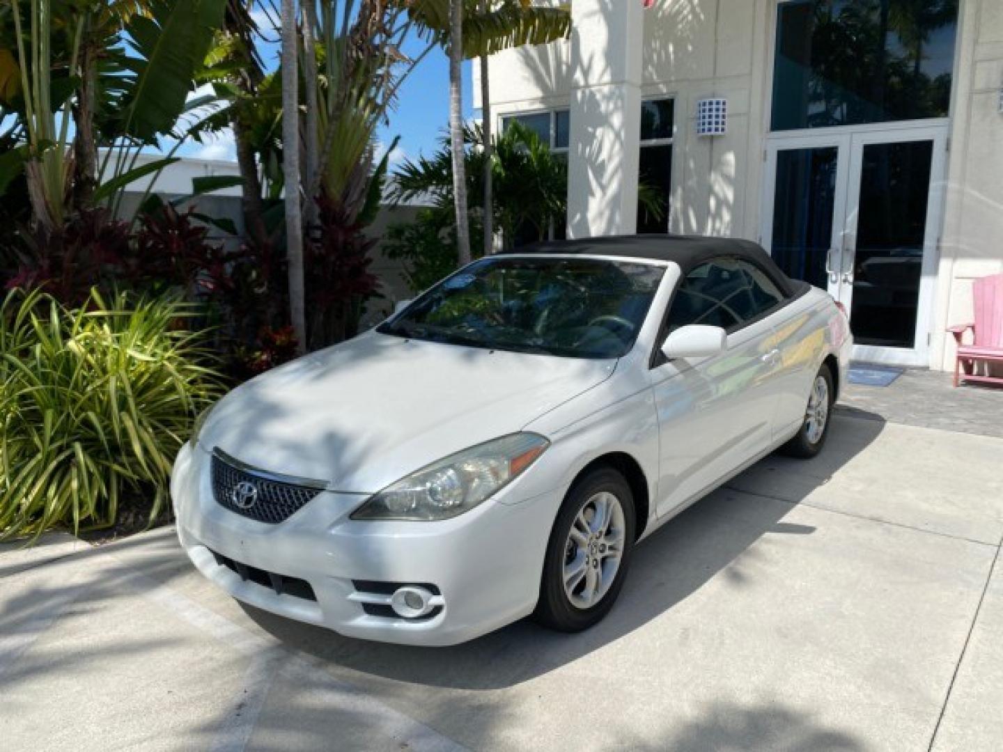 2008 Blizzard White Pearl /Dark Gray Toyota Camry Solara SE CONVERTIBLE LOW MILES 74,665 (4T1FA38PX8U) with an 3.3L DOHC SMPI VVT-i 24-Valve V6 Engine engine, Automatic transmission, located at 4701 North Dixie Hwy, Pompano Beach, FL, 33064, (954) 422-2889, 26.240938, -80.123474 - OUR WEBPAGE FLORIDACARS1.COM HAS OVER 100 PHOTOS AND FREE CARFAX LINK 2008 Toyota Camry Solara SE V6 Convertible 3.3L V6 F DOHC 24V Gasoline 29 MPG Front Wheel Drive Features ABS Brakes Air Conditioning Alloy Wheels AM/FM Stereo Automatic Transmission Auxiliary Audio Input CD Audio Cruise Control Le- Photo#30