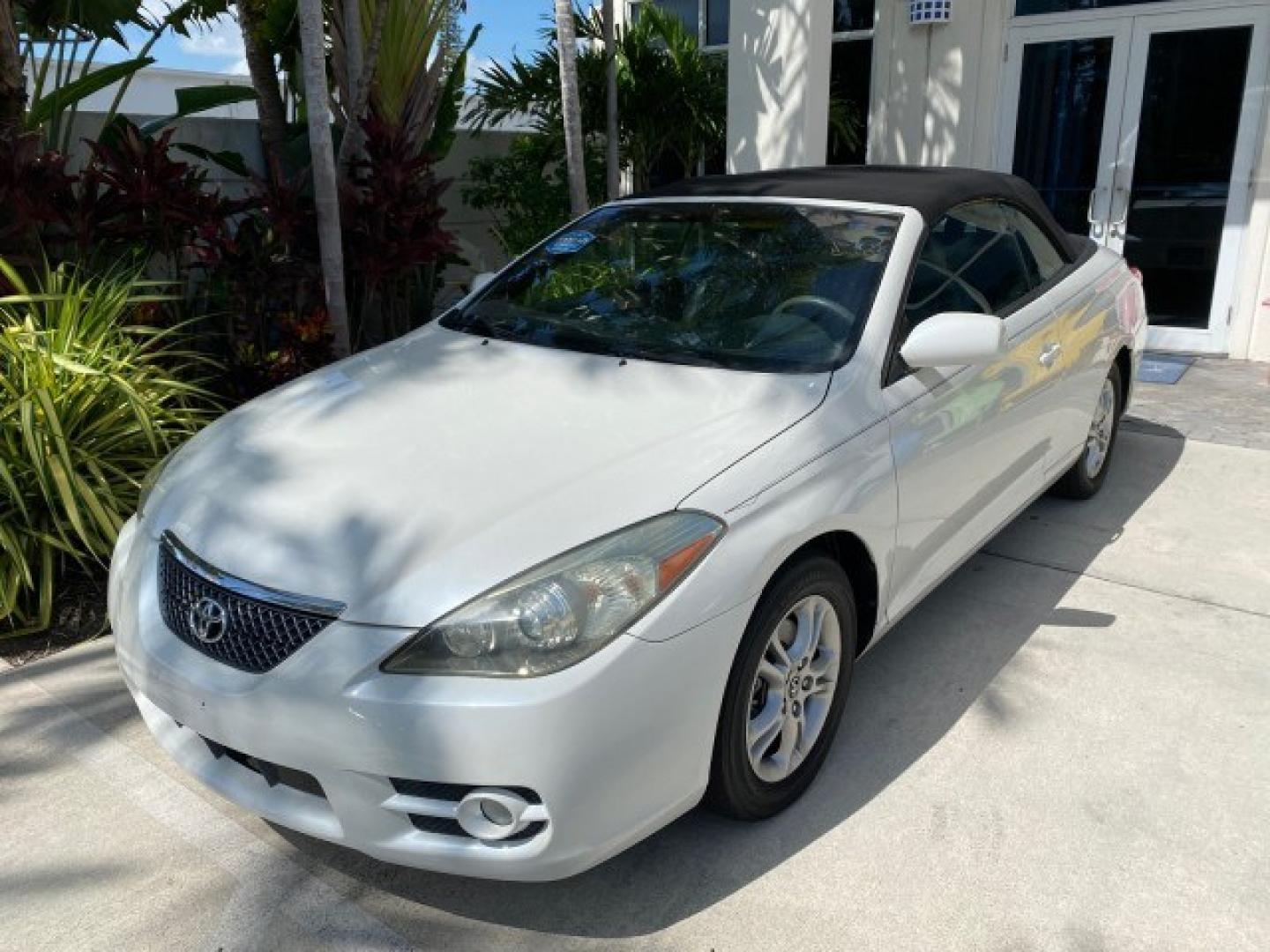 2008 Blizzard White Pearl /Dark Gray Toyota Camry Solara SE CONVERTIBLE LOW MILES 74,665 (4T1FA38PX8U) with an 3.3L DOHC SMPI VVT-i 24-Valve V6 Engine engine, Automatic transmission, located at 4701 North Dixie Hwy, Pompano Beach, FL, 33064, (954) 422-2889, 26.240938, -80.123474 - OUR WEBPAGE FLORIDACARS1.COM HAS OVER 100 PHOTOS AND FREE CARFAX LINK 2008 Toyota Camry Solara SE V6 Convertible 3.3L V6 F DOHC 24V Gasoline 29 MPG Front Wheel Drive Features ABS Brakes Air Conditioning Alloy Wheels AM/FM Stereo Automatic Transmission Auxiliary Audio Input CD Audio Cruise Control Le- Photo#32