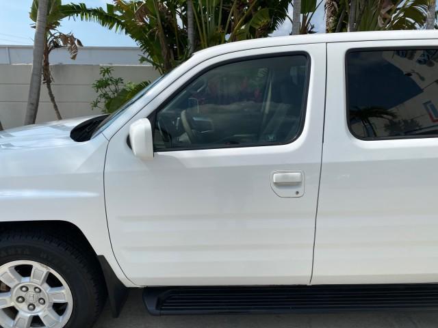 2008 Taffeta White /Beige Honda Ridgeline RTS 4WD LOW MILES 73,653 1 OWNER (2HJYK16428H) with an 3.5L SOHC MPFI 24-Valve VTEC V6 Engine engine, Automatic transmission, located at 4701 North Dixie Hwy, Pompano Beach, FL, 33064, (954) 422-2889, 26.240938, -80.123474 - OUR WEBPAGE FLORIDACARS1.COM HAS OVER 100 PHOTOS AND FREE CARFAX LINK 2008 Honda Ridgeline RTS 1 OWNER Crew Pickup 3.5L V6 F SOHC 24V Gasoline 21 MPG Front Wheel Drive w/ 4X4 Features 4WD/AWD ABS Brakes Air Conditioning Alloy Wheels AM/FM Stereo Automatic Transmission CD Audio Cloth Seats Cruise Con - Photo#37