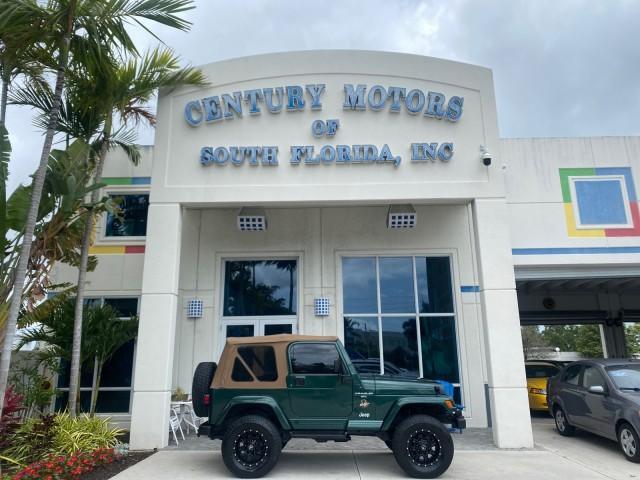1999 Forest Green Pearl /Camel/Dark Green Jeep Wrangler Sahara AUYO AC 6 CYL LOW MILES 47,009 (1J4FY49S0XP) with an 4.0L SMPI I6 Power Tech Engine engine, Automatic transmission, located at 4701 North Dixie Hwy, Pompano Beach, FL, 33064, (954) 422-2889, 26.240938, -80.123474 - OUR WEBPAGE FLORIDACARS1.COM HAS OVER 100 PHOTOS AND FREE CARFAX LINK 1999 Jeep Wrangler Sahara Utility (Blazer, Jimmy, Scout, etc.) 4.0L I6 F Gasoline 20 MPG Rear Wheel Drive w/ 4X4 Features 4WD/AWD ABS Brakes Air Conditioning Alloy Wheels AM/FM Stereo Automatic Transmission Cassette Player CD Audi - Photo#0