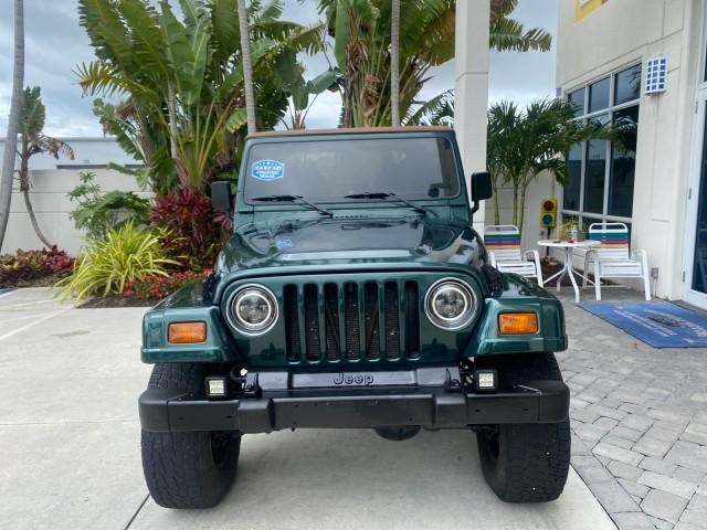 1999 Forest Green Pearl /Camel/Dark Green Jeep Wrangler Sahara AUYO AC 6 CYL LOW MILES 47,009 (1J4FY49S0XP) with an 4.0L SMPI I6 Power Tech Engine engine, Automatic transmission, located at 4701 North Dixie Hwy, Pompano Beach, FL, 33064, (954) 422-2889, 26.240938, -80.123474 - OUR WEBPAGE FLORIDACARS1.COM HAS OVER 100 PHOTOS AND FREE CARFAX LINK 1999 Jeep Wrangler Sahara Utility (Blazer, Jimmy, Scout, etc.) 4.0L I6 F Gasoline 20 MPG Rear Wheel Drive w/ 4X4 Features 4WD/AWD ABS Brakes Air Conditioning Alloy Wheels AM/FM Stereo Automatic Transmission Cassette Player CD Audi - Photo#2