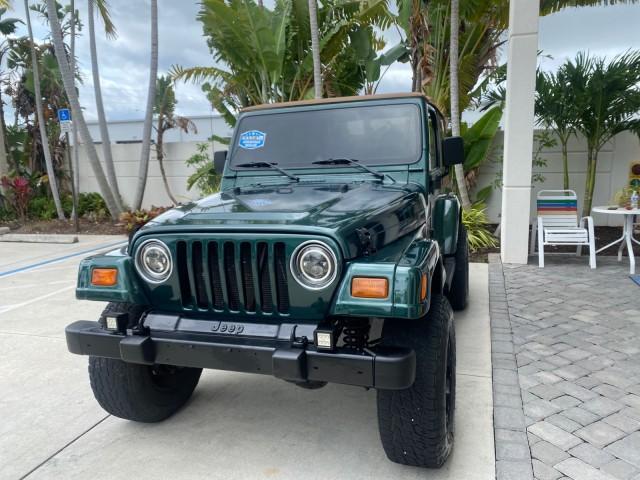 1999 Forest Green Pearl /Camel/Dark Green Jeep Wrangler Sahara AUYO AC 6 CYL LOW MILES 47,009 (1J4FY49S0XP) with an 4.0L SMPI I6 Power Tech Engine engine, Automatic transmission, located at 4701 North Dixie Hwy, Pompano Beach, FL, 33064, (954) 422-2889, 26.240938, -80.123474 - OUR WEBPAGE FLORIDACARS1.COM HAS OVER 100 PHOTOS AND FREE CARFAX LINK 1999 Jeep Wrangler Sahara Utility (Blazer, Jimmy, Scout, etc.) 4.0L I6 F Gasoline 20 MPG Rear Wheel Drive w/ 4X4 Features 4WD/AWD ABS Brakes Air Conditioning Alloy Wheels AM/FM Stereo Automatic Transmission Cassette Player CD Audi - Photo#3