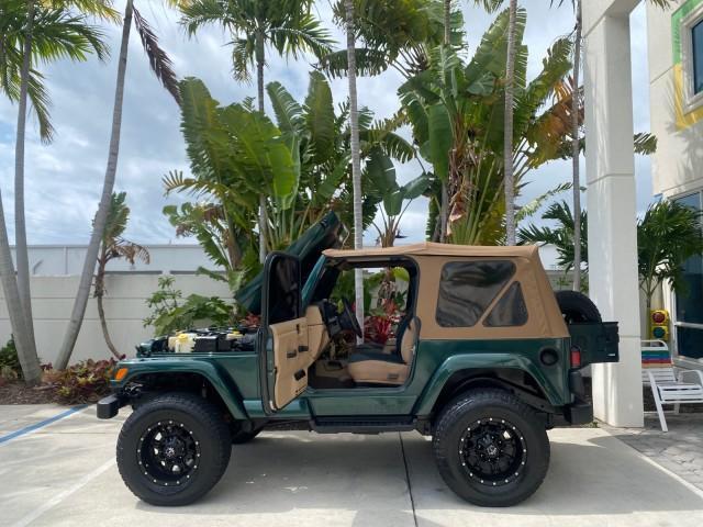 1999 Forest Green Pearl /Camel/Dark Green Jeep Wrangler Sahara AUYO AC 6 CYL LOW MILES 47,009 (1J4FY49S0XP) with an 4.0L SMPI I6 Power Tech Engine engine, Automatic transmission, located at 4701 North Dixie Hwy, Pompano Beach, FL, 33064, (954) 422-2889, 26.240938, -80.123474 - OUR WEBPAGE FLORIDACARS1.COM HAS OVER 100 PHOTOS AND FREE CARFAX LINK 1999 Jeep Wrangler Sahara Utility (Blazer, Jimmy, Scout, etc.) 4.0L I6 F Gasoline 20 MPG Rear Wheel Drive w/ 4X4 Features 4WD/AWD ABS Brakes Air Conditioning Alloy Wheels AM/FM Stereo Automatic Transmission Cassette Player CD Audi - Photo#8