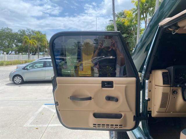 1999 Forest Green Pearl /Camel/Dark Green Jeep Wrangler Sahara AUYO AC 6 CYL LOW MILES 47,009 (1J4FY49S0XP) with an 4.0L SMPI I6 Power Tech Engine engine, Automatic transmission, located at 4701 North Dixie Hwy, Pompano Beach, FL, 33064, (954) 422-2889, 26.240938, -80.123474 - OUR WEBPAGE FLORIDACARS1.COM HAS OVER 100 PHOTOS AND FREE CARFAX LINK 1999 Jeep Wrangler Sahara Utility (Blazer, Jimmy, Scout, etc.) 4.0L I6 F Gasoline 20 MPG Rear Wheel Drive w/ 4X4 Features 4WD/AWD ABS Brakes Air Conditioning Alloy Wheels AM/FM Stereo Automatic Transmission Cassette Player CD Audi - Photo#9