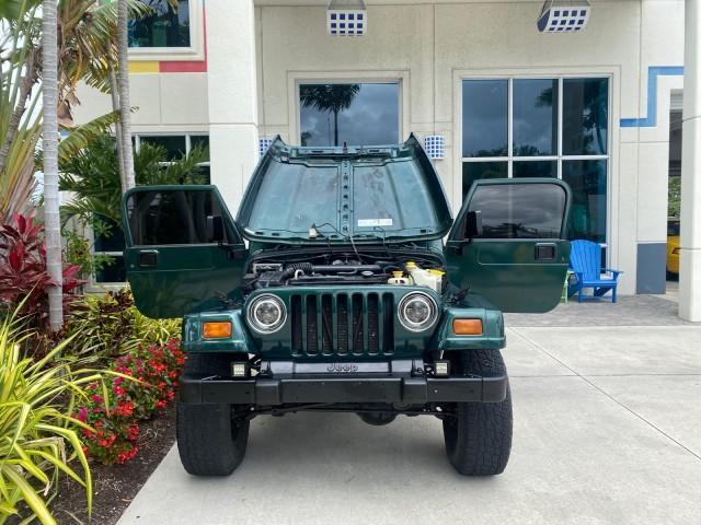 1999 Forest Green Pearl /Camel/Dark Green Jeep Wrangler Sahara AUYO AC 6 CYL LOW MILES 47,009 (1J4FY49S0XP) with an 4.0L SMPI I6 Power Tech Engine engine, Automatic transmission, located at 4701 North Dixie Hwy, Pompano Beach, FL, 33064, (954) 422-2889, 26.240938, -80.123474 - OUR WEBPAGE FLORIDACARS1.COM HAS OVER 100 PHOTOS AND FREE CARFAX LINK 1999 Jeep Wrangler Sahara Utility (Blazer, Jimmy, Scout, etc.) 4.0L I6 F Gasoline 20 MPG Rear Wheel Drive w/ 4X4 Features 4WD/AWD ABS Brakes Air Conditioning Alloy Wheels AM/FM Stereo Automatic Transmission Cassette Player CD Audi - Photo#16