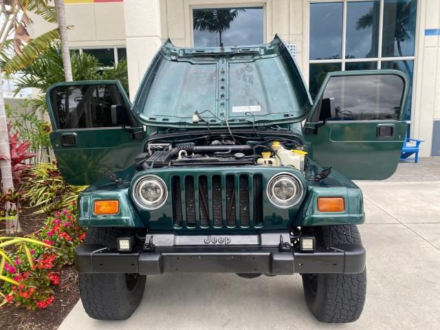1999 Forest Green Pearl /Camel/Dark Green Jeep Wrangler Sahara AUYO AC 6 CYL LOW MILES 47,009 (1J4FY49S0XP) with an 4.0L SMPI I6 Power Tech Engine engine, Automatic transmission, located at 4701 North Dixie Hwy, Pompano Beach, FL, 33064, (954) 422-2889, 26.240938, -80.123474 - OUR WEBPAGE FLORIDACARS1.COM HAS OVER 100 PHOTOS AND FREE CARFAX LINK 1999 Jeep Wrangler Sahara Utility (Blazer, Jimmy, Scout, etc.) 4.0L I6 F Gasoline 20 MPG Rear Wheel Drive w/ 4X4 Features 4WD/AWD ABS Brakes Air Conditioning Alloy Wheels AM/FM Stereo Automatic Transmission Cassette Player CD Audi - Photo#17