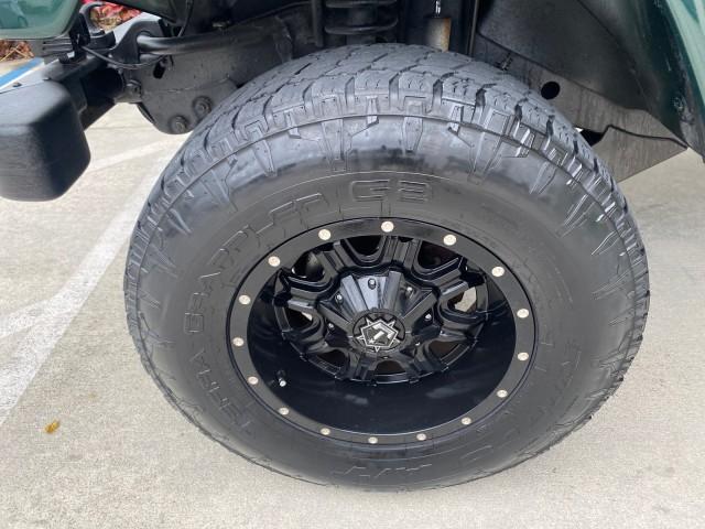 1999 Forest Green Pearl /Camel/Dark Green Jeep Wrangler Sahara AUYO AC 6 CYL LOW MILES 47,009 (1J4FY49S0XP) with an 4.0L SMPI I6 Power Tech Engine engine, Automatic transmission, located at 4701 North Dixie Hwy, Pompano Beach, FL, 33064, (954) 422-2889, 26.240938, -80.123474 - OUR WEBPAGE FLORIDACARS1.COM HAS OVER 100 PHOTOS AND FREE CARFAX LINK 1999 Jeep Wrangler Sahara Utility (Blazer, Jimmy, Scout, etc.) 4.0L I6 F Gasoline 20 MPG Rear Wheel Drive w/ 4X4 Features 4WD/AWD ABS Brakes Air Conditioning Alloy Wheels AM/FM Stereo Automatic Transmission Cassette Player CD Audi - Photo#19