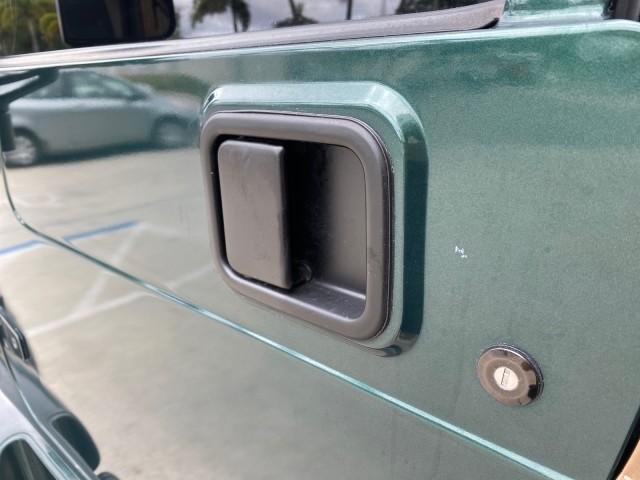 1999 Forest Green Pearl /Camel/Dark Green Jeep Wrangler Sahara AUYO AC 6 CYL LOW MILES 47,009 (1J4FY49S0XP) with an 4.0L SMPI I6 Power Tech Engine engine, Automatic transmission, located at 4701 North Dixie Hwy, Pompano Beach, FL, 33064, (954) 422-2889, 26.240938, -80.123474 - OUR WEBPAGE FLORIDACARS1.COM HAS OVER 100 PHOTOS AND FREE CARFAX LINK 1999 Jeep Wrangler Sahara Utility (Blazer, Jimmy, Scout, etc.) 4.0L I6 F Gasoline 20 MPG Rear Wheel Drive w/ 4X4 Features 4WD/AWD ABS Brakes Air Conditioning Alloy Wheels AM/FM Stereo Automatic Transmission Cassette Player CD Audi - Photo#37