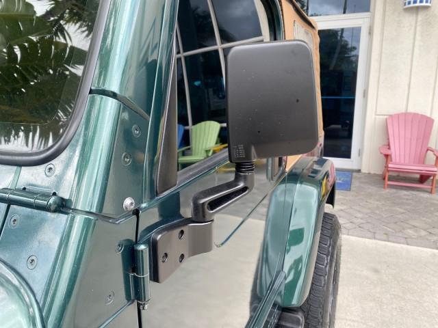 1999 Forest Green Pearl /Camel/Dark Green Jeep Wrangler Sahara AUYO AC 6 CYL LOW MILES 47,009 (1J4FY49S0XP) with an 4.0L SMPI I6 Power Tech Engine engine, Automatic transmission, located at 4701 North Dixie Hwy, Pompano Beach, FL, 33064, (954) 422-2889, 26.240938, -80.123474 - OUR WEBPAGE FLORIDACARS1.COM HAS OVER 100 PHOTOS AND FREE CARFAX LINK 1999 Jeep Wrangler Sahara Utility (Blazer, Jimmy, Scout, etc.) 4.0L I6 F Gasoline 20 MPG Rear Wheel Drive w/ 4X4 Features 4WD/AWD ABS Brakes Air Conditioning Alloy Wheels AM/FM Stereo Automatic Transmission Cassette Player CD Audi - Photo#39