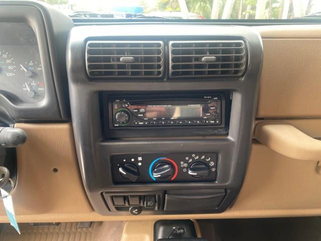 1999 Forest Green Pearl /Camel/Dark Green Jeep Wrangler Sahara AUYO AC 6 CYL LOW MILES 47,009 (1J4FY49S0XP) with an 4.0L SMPI I6 Power Tech Engine engine, Automatic transmission, located at 4701 North Dixie Hwy, Pompano Beach, FL, 33064, (954) 422-2889, 26.240938, -80.123474 - OUR WEBPAGE FLORIDACARS1.COM HAS OVER 100 PHOTOS AND FREE CARFAX LINK 1999 Jeep Wrangler Sahara Utility (Blazer, Jimmy, Scout, etc.) 4.0L I6 F Gasoline 20 MPG Rear Wheel Drive w/ 4X4 Features 4WD/AWD ABS Brakes Air Conditioning Alloy Wheels AM/FM Stereo Automatic Transmission Cassette Player CD Audi - Photo#59