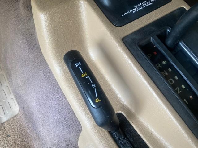 1999 Forest Green Pearl /Camel/Dark Green Jeep Wrangler Sahara AUYO AC 6 CYL LOW MILES 47,009 (1J4FY49S0XP) with an 4.0L SMPI I6 Power Tech Engine engine, Automatic transmission, located at 4701 North Dixie Hwy, Pompano Beach, FL, 33064, (954) 422-2889, 26.240938, -80.123474 - OUR WEBPAGE FLORIDACARS1.COM HAS OVER 100 PHOTOS AND FREE CARFAX LINK 1999 Jeep Wrangler Sahara Utility (Blazer, Jimmy, Scout, etc.) 4.0L I6 F Gasoline 20 MPG Rear Wheel Drive w/ 4X4 Features 4WD/AWD ABS Brakes Air Conditioning Alloy Wheels AM/FM Stereo Automatic Transmission Cassette Player CD Audi - Photo#64