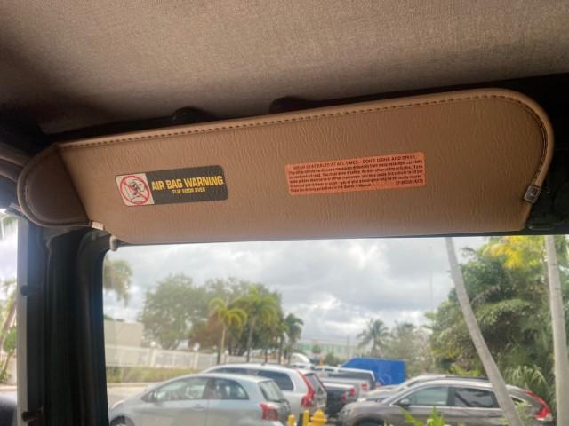 1999 Forest Green Pearl /Camel/Dark Green Jeep Wrangler Sahara AUYO AC 6 CYL LOW MILES 47,009 (1J4FY49S0XP) with an 4.0L SMPI I6 Power Tech Engine engine, Automatic transmission, located at 4701 North Dixie Hwy, Pompano Beach, FL, 33064, (954) 422-2889, 26.240938, -80.123474 - OUR WEBPAGE FLORIDACARS1.COM HAS OVER 100 PHOTOS AND FREE CARFAX LINK 1999 Jeep Wrangler Sahara Utility (Blazer, Jimmy, Scout, etc.) 4.0L I6 F Gasoline 20 MPG Rear Wheel Drive w/ 4X4 Features 4WD/AWD ABS Brakes Air Conditioning Alloy Wheels AM/FM Stereo Automatic Transmission Cassette Player CD Audi - Photo#68