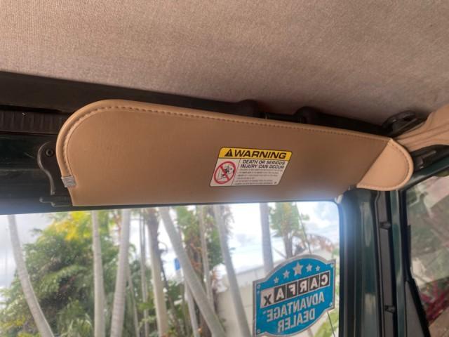 1999 Forest Green Pearl /Camel/Dark Green Jeep Wrangler Sahara AUYO AC 6 CYL LOW MILES 47,009 (1J4FY49S0XP) with an 4.0L SMPI I6 Power Tech Engine engine, Automatic transmission, located at 4701 North Dixie Hwy, Pompano Beach, FL, 33064, (954) 422-2889, 26.240938, -80.123474 - OUR WEBPAGE FLORIDACARS1.COM HAS OVER 100 PHOTOS AND FREE CARFAX LINK 1999 Jeep Wrangler Sahara Utility (Blazer, Jimmy, Scout, etc.) 4.0L I6 F Gasoline 20 MPG Rear Wheel Drive w/ 4X4 Features 4WD/AWD ABS Brakes Air Conditioning Alloy Wheels AM/FM Stereo Automatic Transmission Cassette Player CD Audi - Photo#70