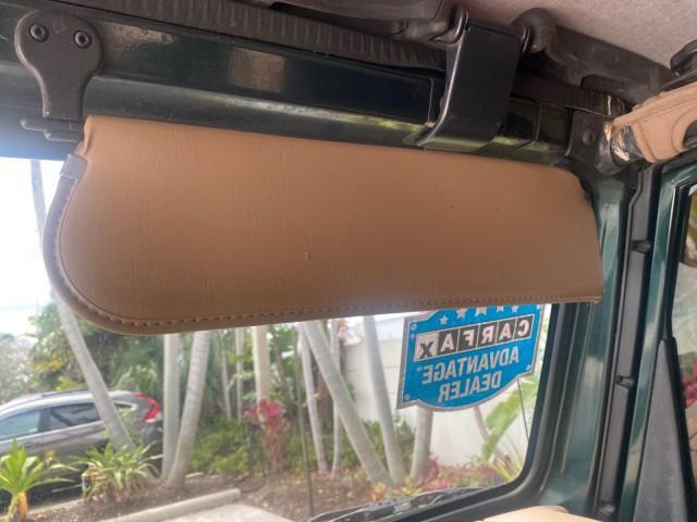 1999 Forest Green Pearl /Camel/Dark Green Jeep Wrangler Sahara AUYO AC 6 CYL LOW MILES 47,009 (1J4FY49S0XP) with an 4.0L SMPI I6 Power Tech Engine engine, Automatic transmission, located at 4701 North Dixie Hwy, Pompano Beach, FL, 33064, (954) 422-2889, 26.240938, -80.123474 - OUR WEBPAGE FLORIDACARS1.COM HAS OVER 100 PHOTOS AND FREE CARFAX LINK 1999 Jeep Wrangler Sahara Utility (Blazer, Jimmy, Scout, etc.) 4.0L I6 F Gasoline 20 MPG Rear Wheel Drive w/ 4X4 Features 4WD/AWD ABS Brakes Air Conditioning Alloy Wheels AM/FM Stereo Automatic Transmission Cassette Player CD Audi - Photo#71