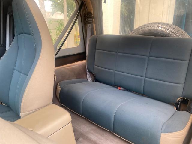 1999 Forest Green Pearl /Camel/Dark Green Jeep Wrangler Sahara AUYO AC 6 CYL LOW MILES 47,009 (1J4FY49S0XP) with an 4.0L SMPI I6 Power Tech Engine engine, Automatic transmission, located at 4701 North Dixie Hwy, Pompano Beach, FL, 33064, (954) 422-2889, 26.240938, -80.123474 - OUR WEBPAGE FLORIDACARS1.COM HAS OVER 100 PHOTOS AND FREE CARFAX LINK 1999 Jeep Wrangler Sahara Utility (Blazer, Jimmy, Scout, etc.) 4.0L I6 F Gasoline 20 MPG Rear Wheel Drive w/ 4X4 Features 4WD/AWD ABS Brakes Air Conditioning Alloy Wheels AM/FM Stereo Automatic Transmission Cassette Player CD Audi - Photo#74