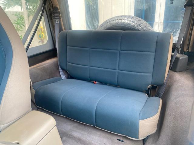 1999 Forest Green Pearl /Camel/Dark Green Jeep Wrangler Sahara AUYO AC 6 CYL LOW MILES 47,009 (1J4FY49S0XP) with an 4.0L SMPI I6 Power Tech Engine engine, Automatic transmission, located at 4701 North Dixie Hwy, Pompano Beach, FL, 33064, (954) 422-2889, 26.240938, -80.123474 - OUR WEBPAGE FLORIDACARS1.COM HAS OVER 100 PHOTOS AND FREE CARFAX LINK 1999 Jeep Wrangler Sahara Utility (Blazer, Jimmy, Scout, etc.) 4.0L I6 F Gasoline 20 MPG Rear Wheel Drive w/ 4X4 Features 4WD/AWD ABS Brakes Air Conditioning Alloy Wheels AM/FM Stereo Automatic Transmission Cassette Player CD Audi - Photo#75